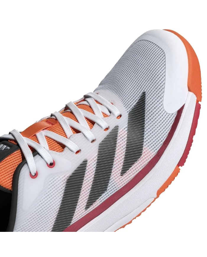 Scarpa da corsa Adidas Crazyquicks Padel JR4647, vista laterale: tomaia grigia con strisce nere, lacci bianchi, dettagli arancio