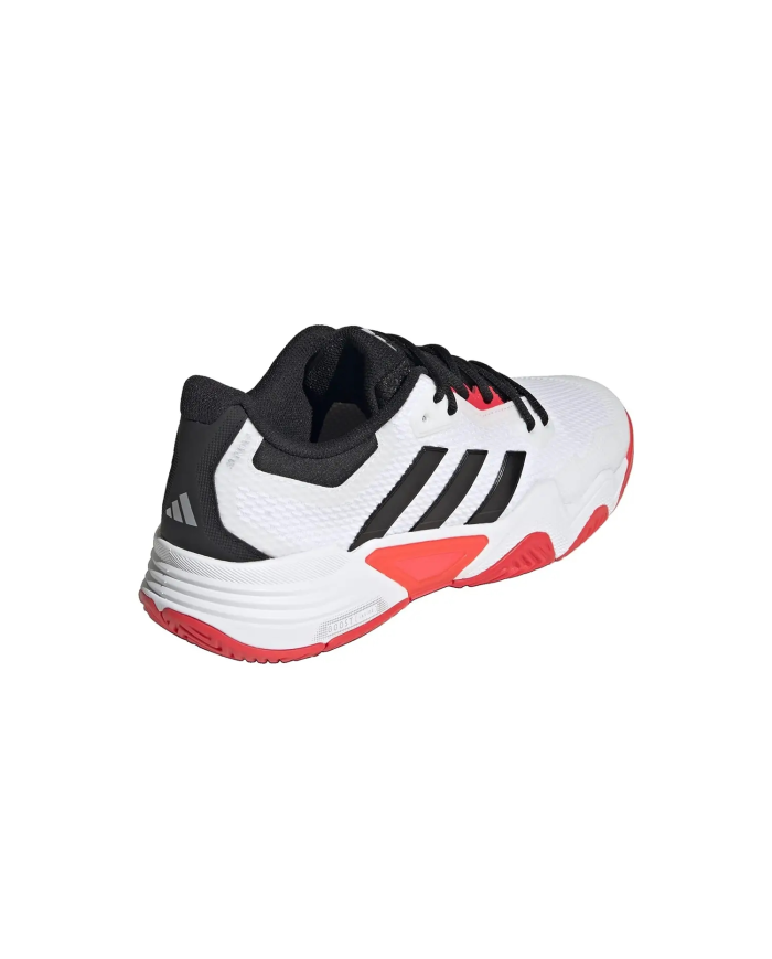 Scarpe da corsa Adidas bianche con strisce nere, tallone nero e suola rossa, modello Solematch Ccontrol 2M IH3088.
