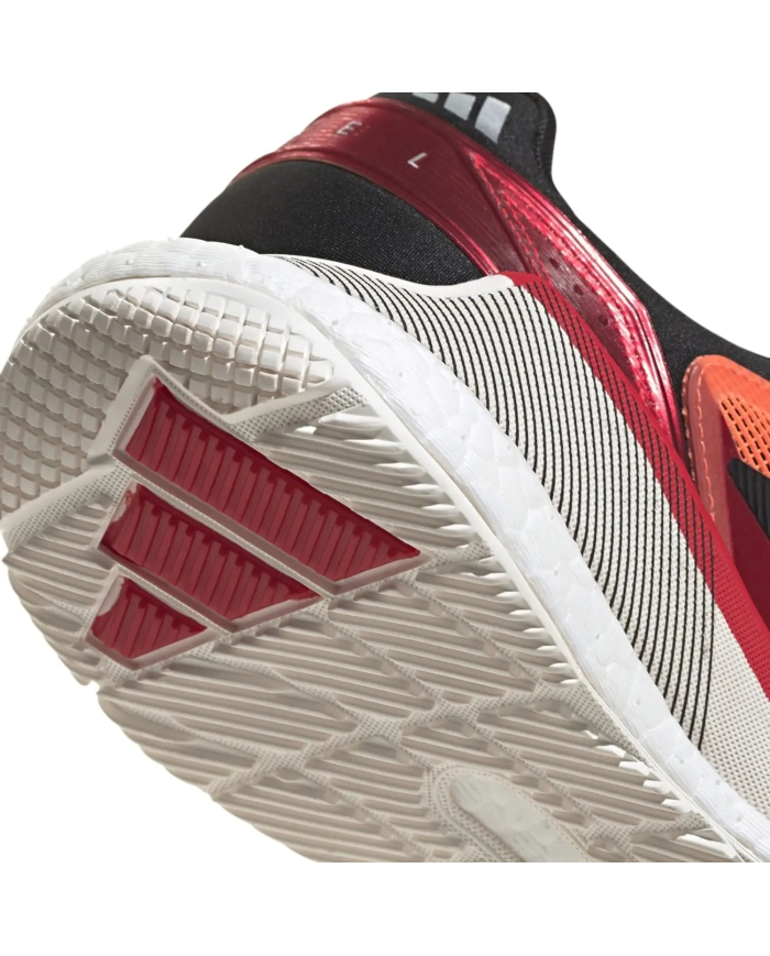 Scarpa da padel Adidas Crazyquick Boost arancione, vista dal tallone e suola con battistrada bianca e divisioni rosse.